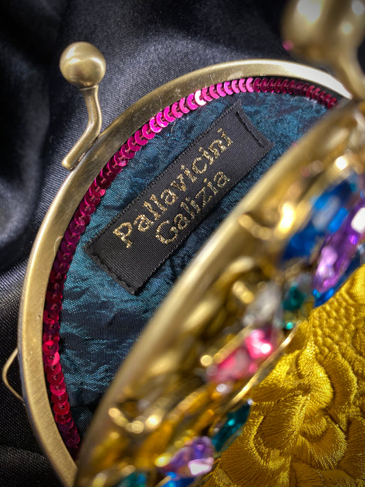 handmade handbag with costume gems and yellow, satin vintage fabric.