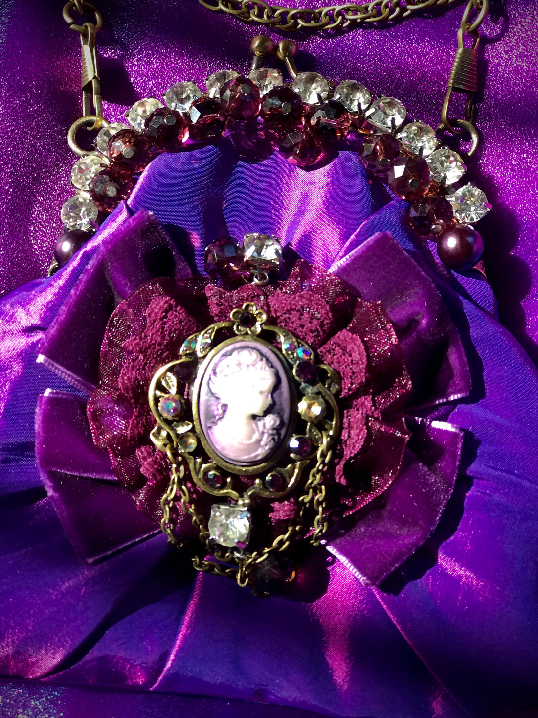 Handmade, purple, satin handbag with cameo, diamanté and velvet bow.