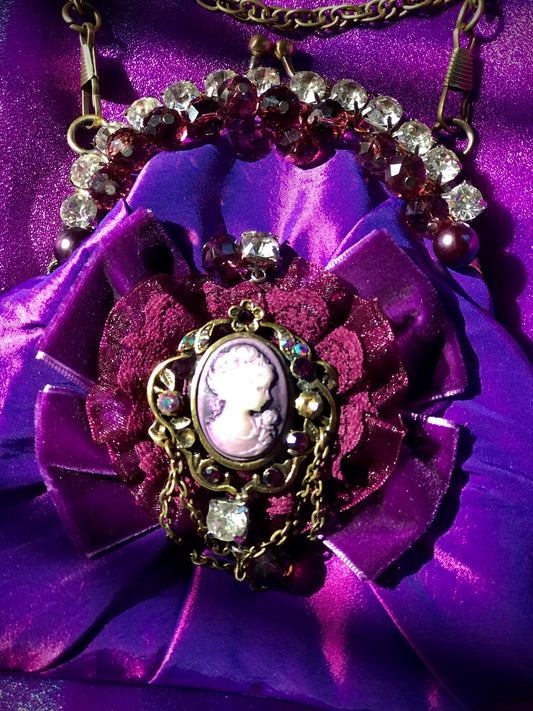 Handmade, purple, satin handbag with cameo, diamanté and velvet bow.
