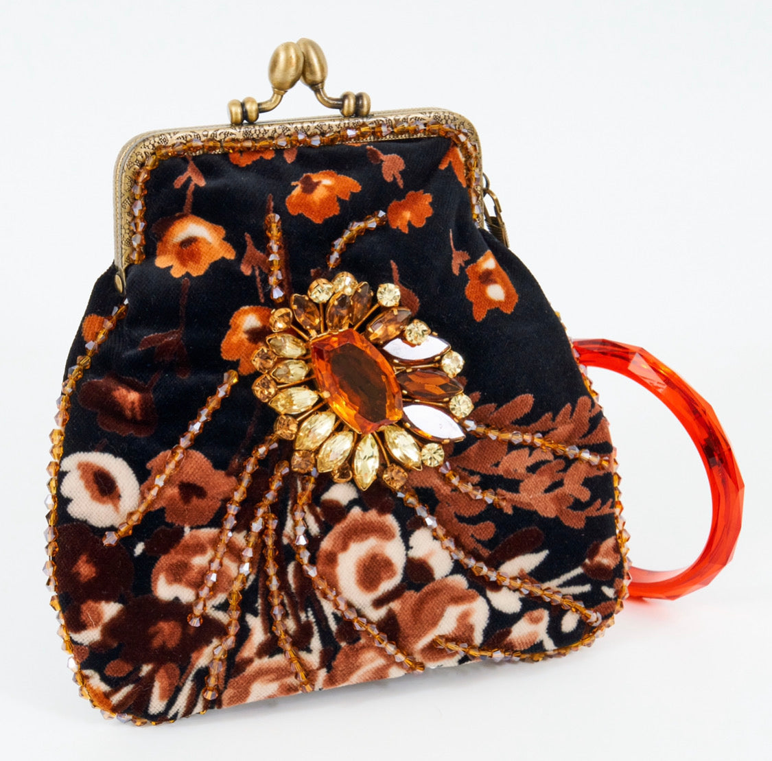 Meet Heather. A black, velvet wristlet purse with an antique centrepiece.