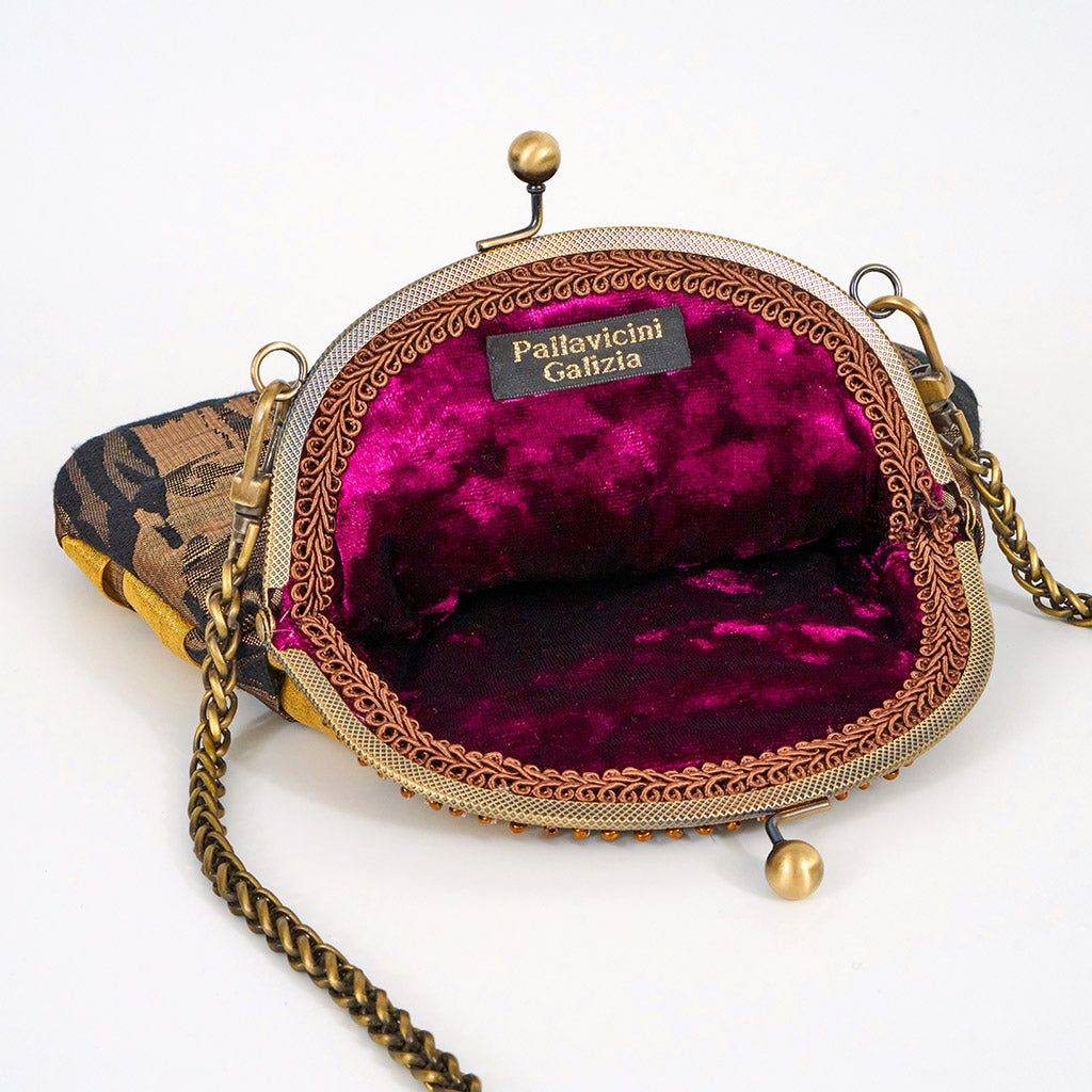 Meet Olympia. A gold, brown and black handbag with circular pearl motifs.