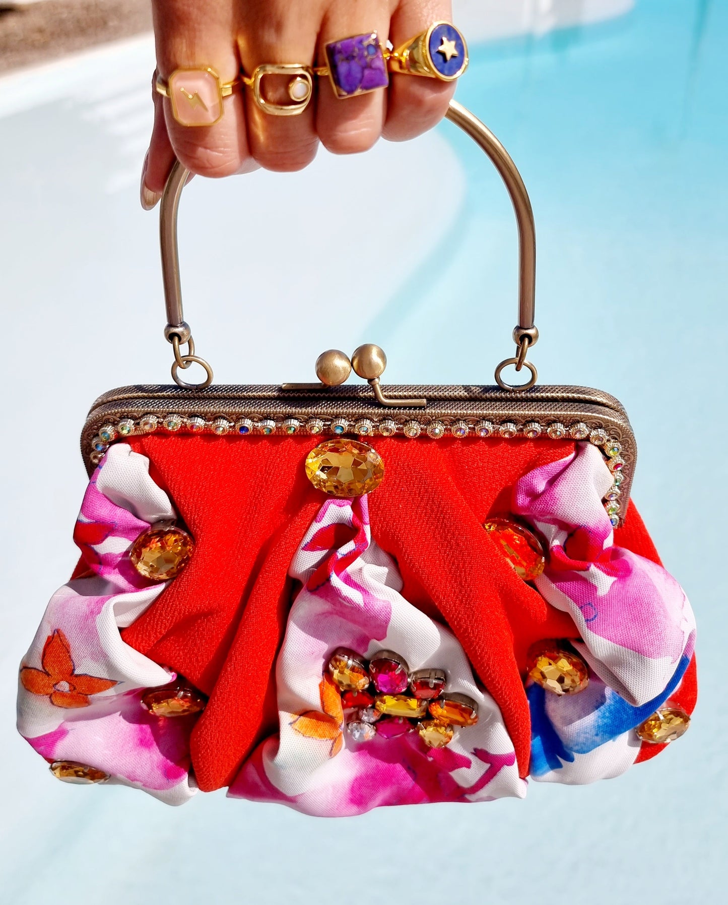 Meet Chloe. An orange and Louis Vuitton textile bag with jumbo, statement diamanté.