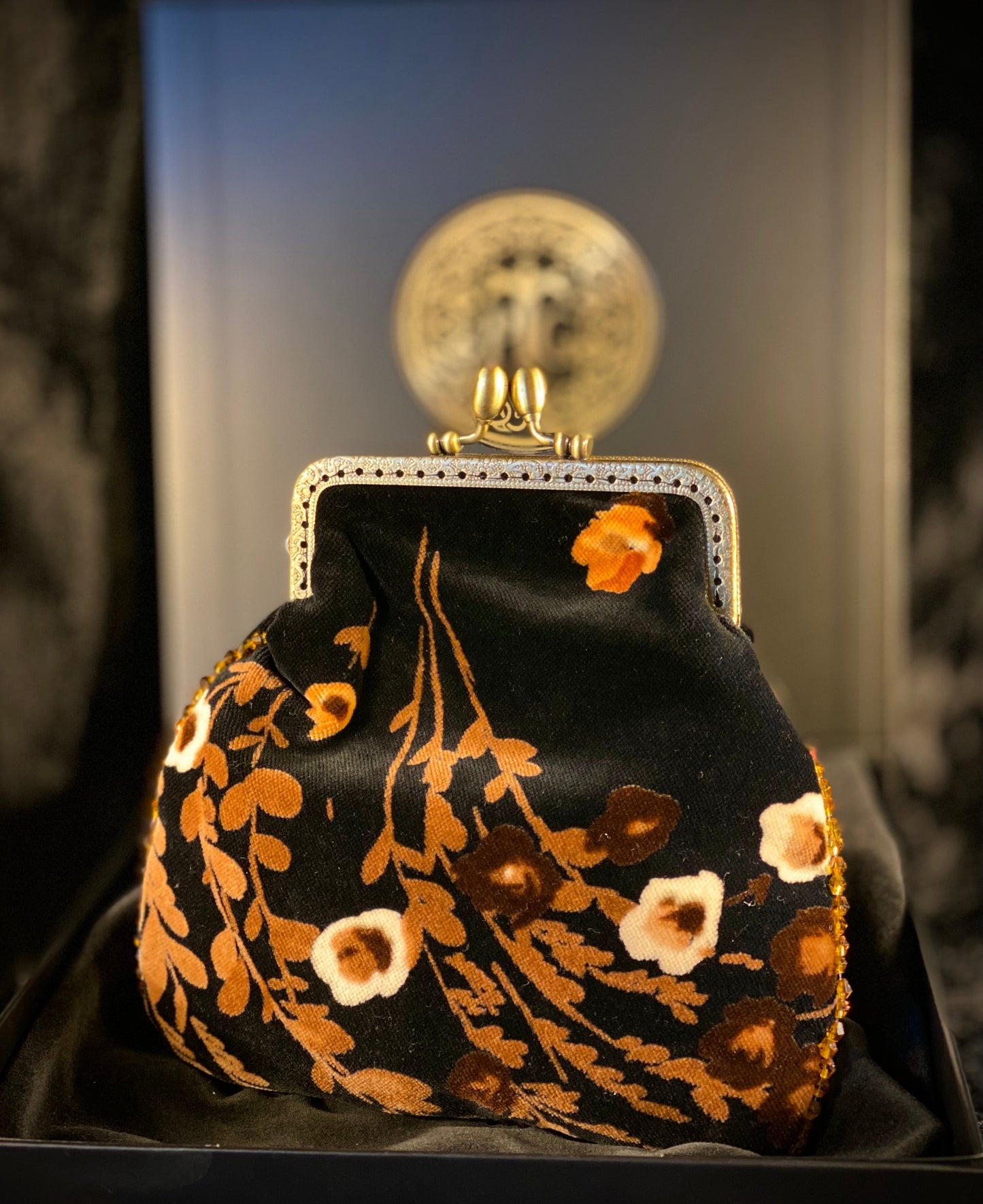 Meet Heather. A black, velvet wristlet purse with an antique centrepiece.