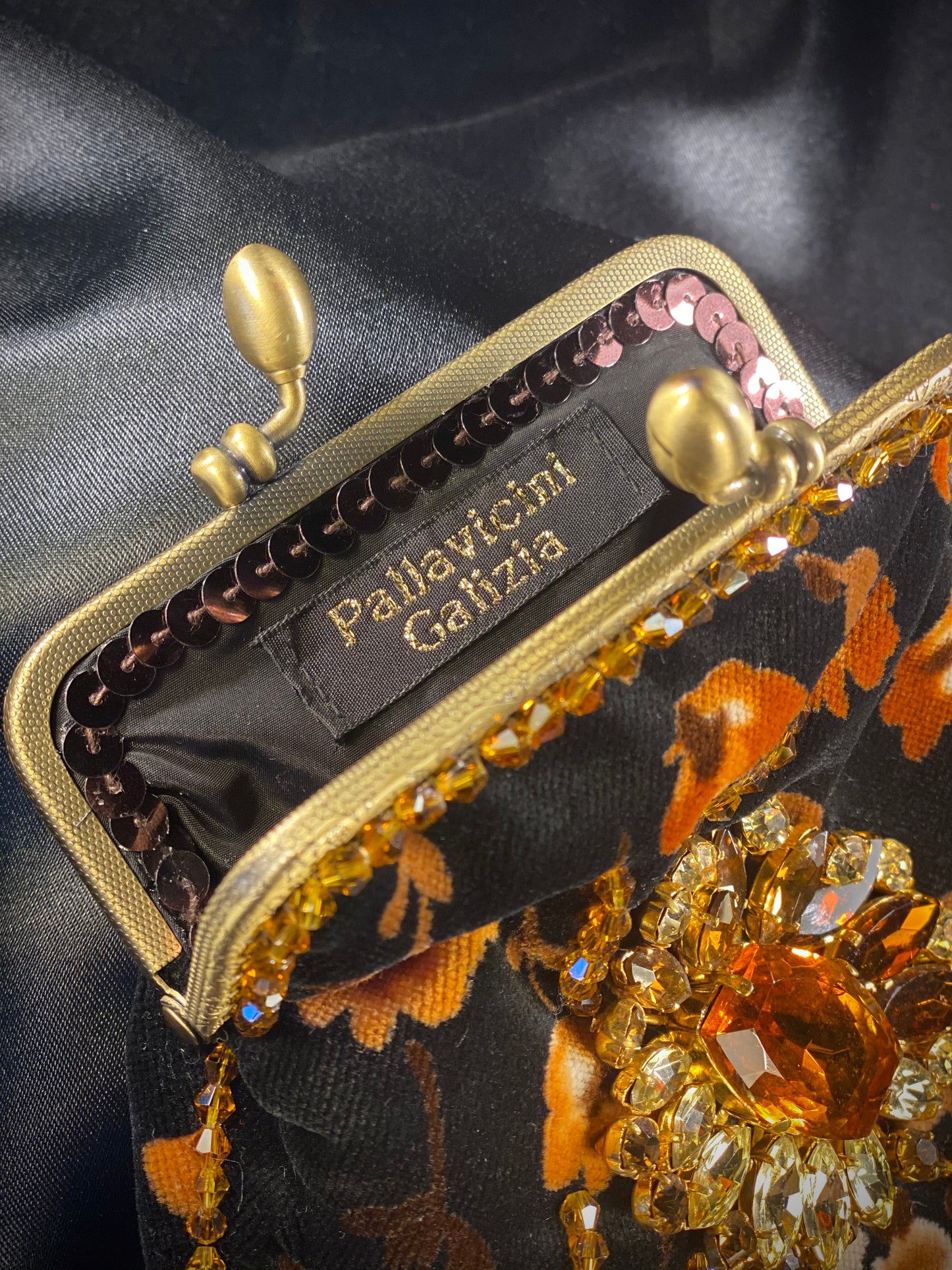 Meet Heather. A black, velvet wristlet purse with an antique centrepiece.