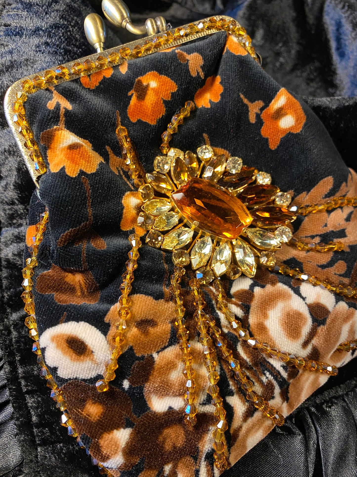 Meet Heather. A black, velvet wristlet purse with an antique centrepiece.