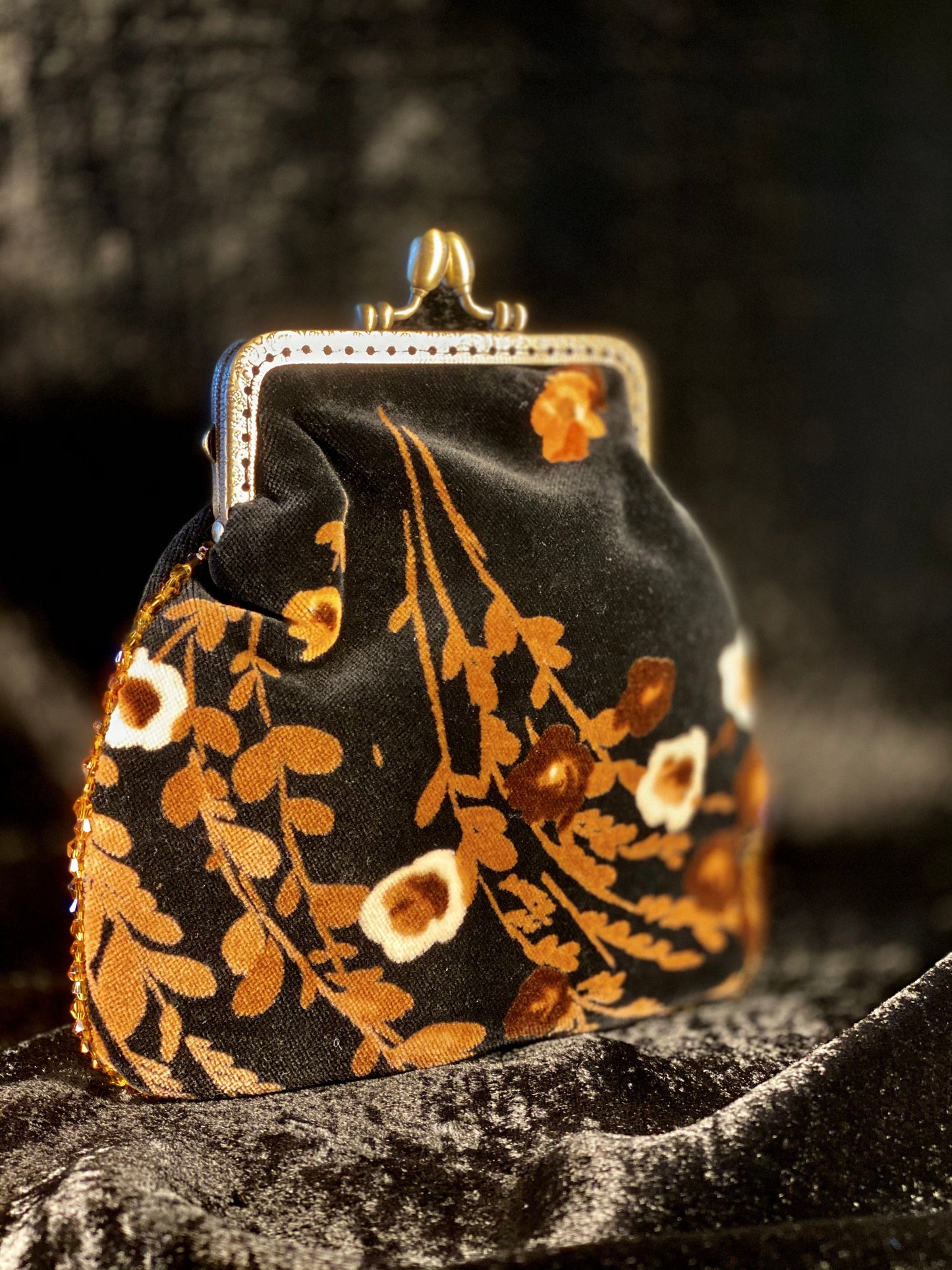 Meet Heather. A black, velvet wristlet purse with an antique centrepiece.
