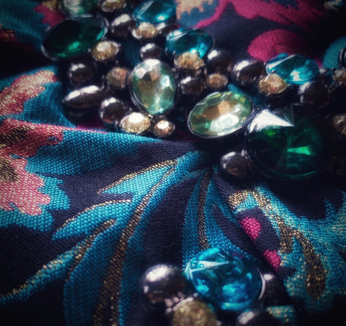 Meet Freda. A blue, pink and black wristlet purse with garland style, rhinestone embellishment.