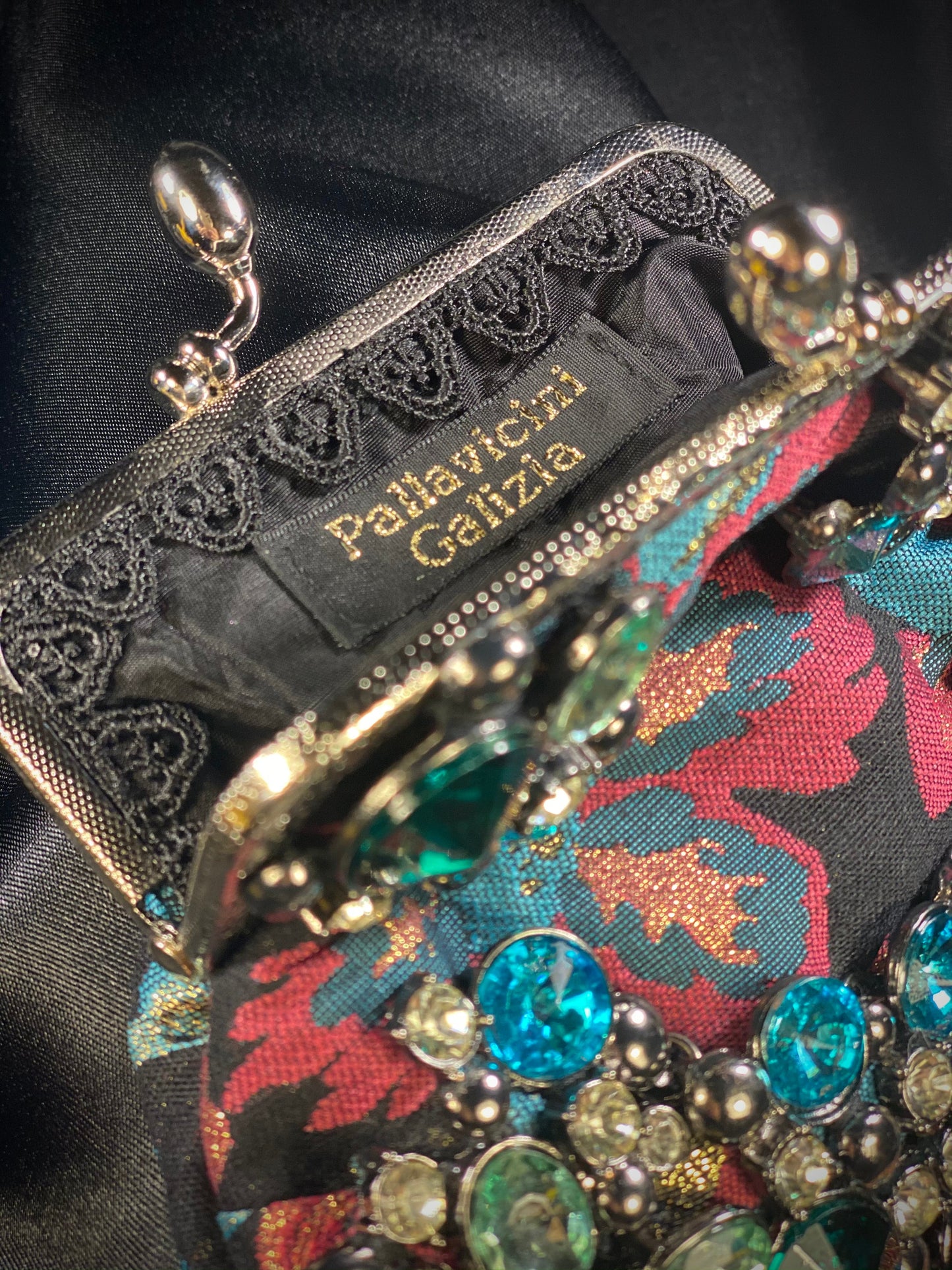 Meet Freda. A blue, pink and black wristlet purse with garland style, rhinestone embellishment.