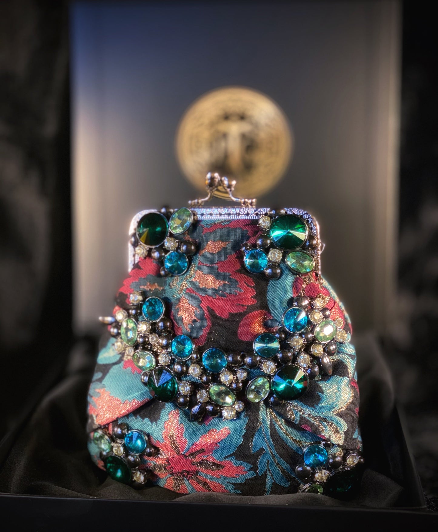 Meet Freda. A blue, pink and black wristlet purse with garland style, rhinestone embellishment.