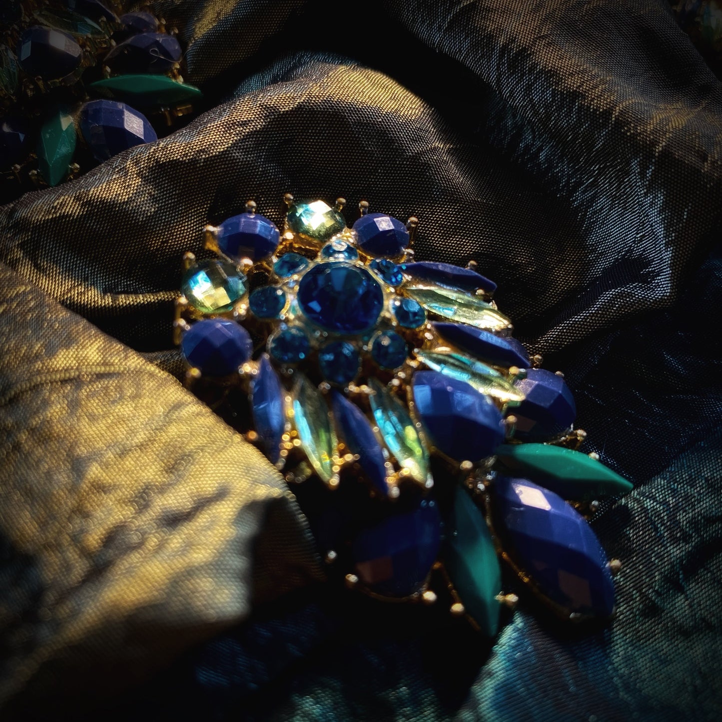 Meet Amalia. An emerald, blue and green silk bag with vintage embellishments