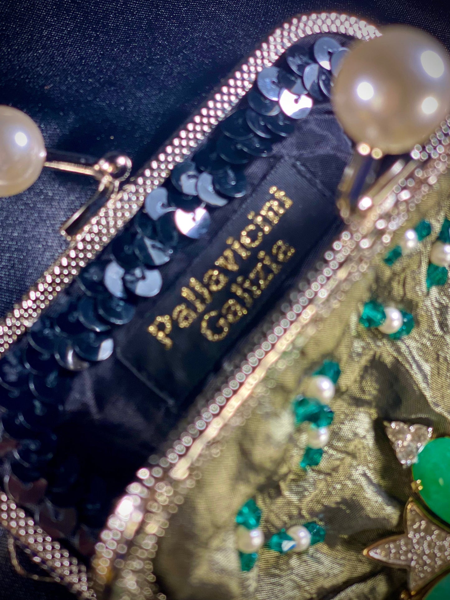 Meet Fern. A green, silk wristlet purse with faux pearl clasp and an antique green stone centrepiece.