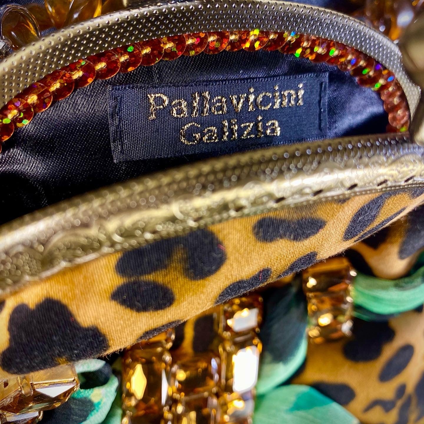 Meet Tabatha. A leopard print and green textile handbag with bronze rhinestones.