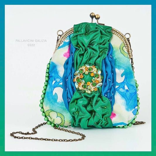 Meet Robyn. A shimmering green & Louis Vuitton fabric handbag with a diamanté vintage centrepiece.