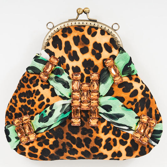 Meet Tabatha. A leopard print and green textile handbag with bronze rhinestones.