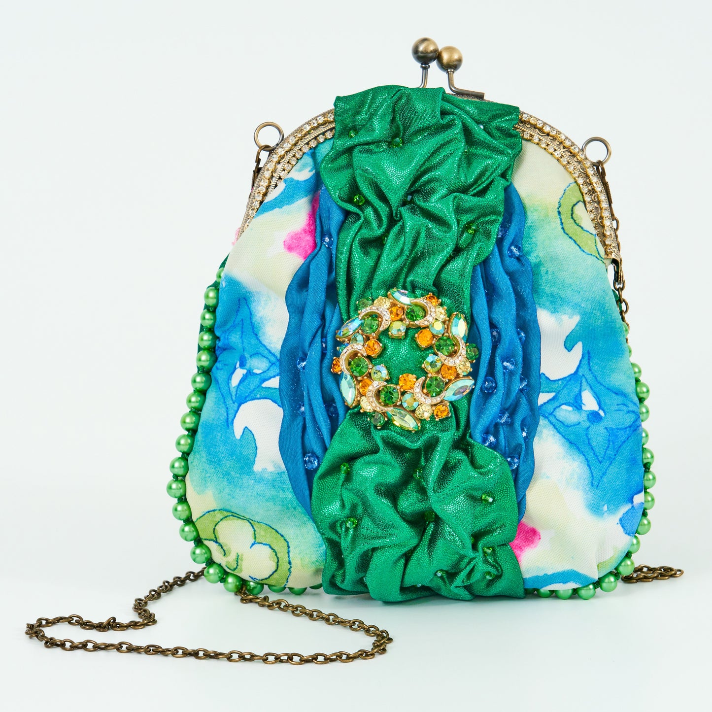 Meet Robyn. A shimmering green & Louis Vuitton fabric handbag with a diamanté vintage centrepiece.